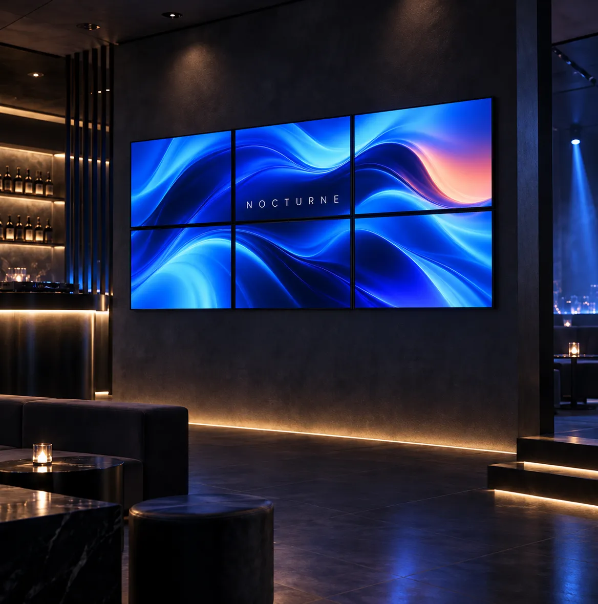 Videowand aus sechs Bildschirmen mit blauen Wellen in einer dunklen Lounge